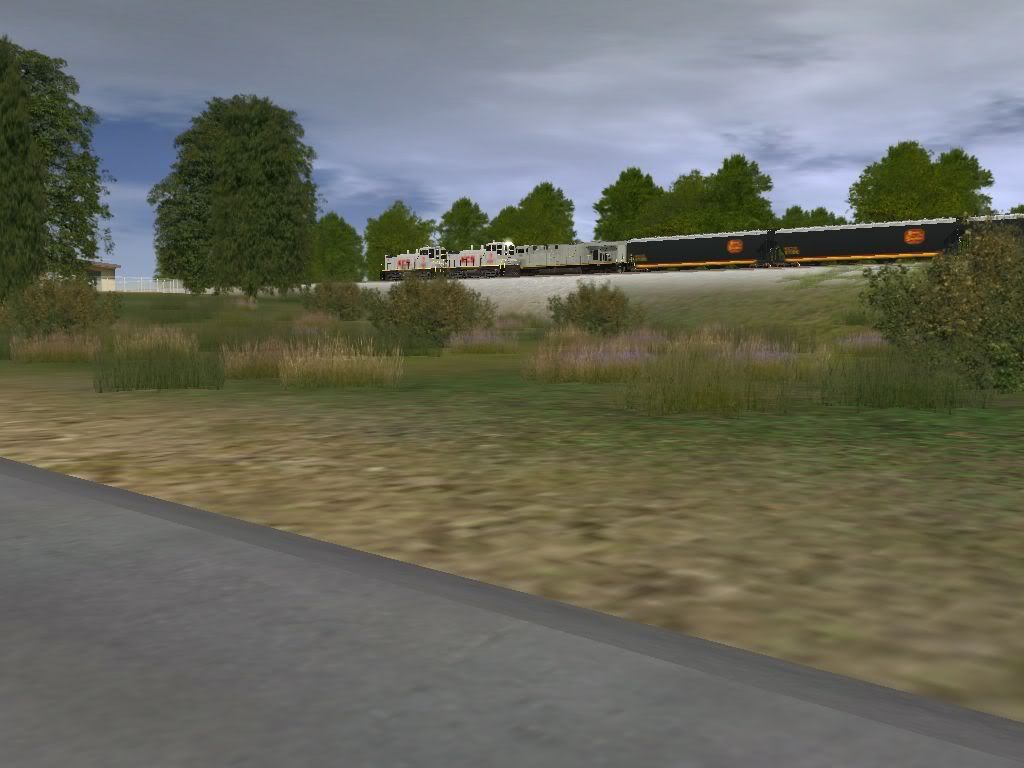 KCSEastboundGrainLeavingDeramusYard.jpg