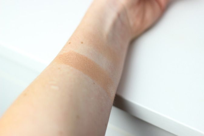 benefit watts up bronze highlight swatched in natural light